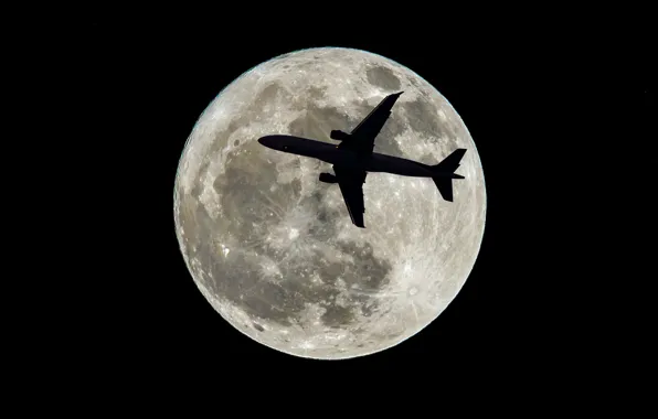 The plane, the moon, satellite, silhouette