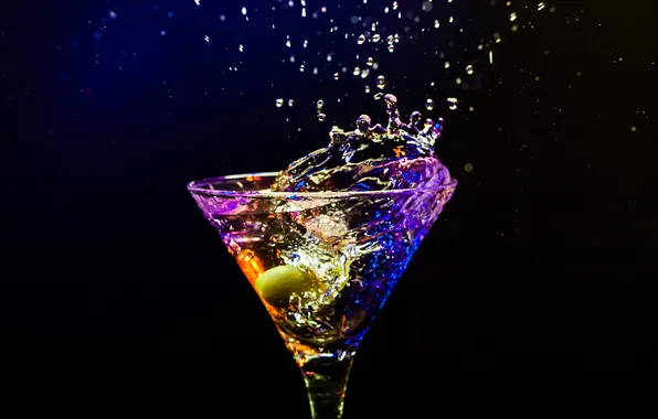 Squirt, glass, cocktail, olive, black background