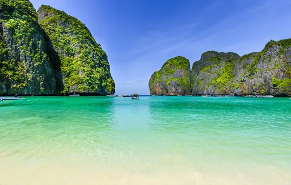 Sea, greens, the sky, the sun, stones, rocks, vegetation, island