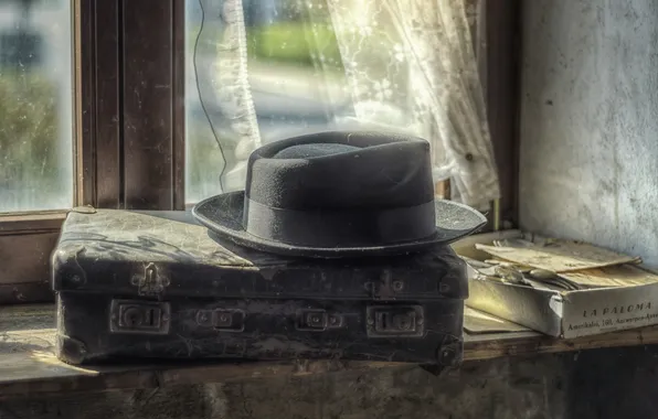 Hat, window, suitcase