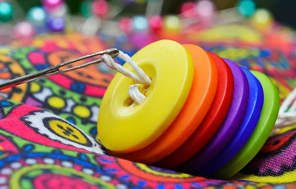 Rainbow, buttons, thread, needle, sewing