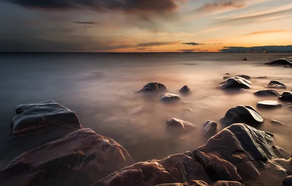 Stones, the ocean, dawn, twilight