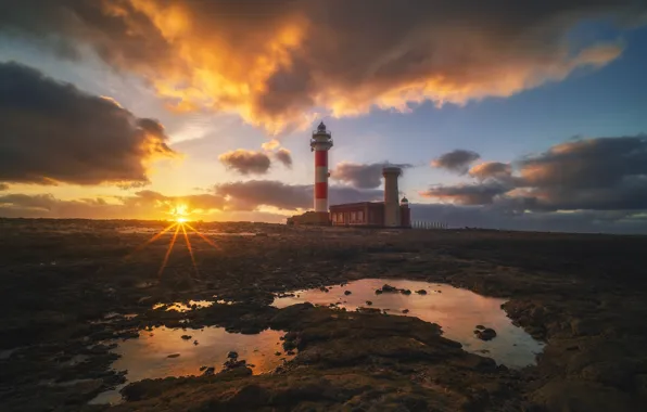The sky, the sun, sunset, shore, lighthouse