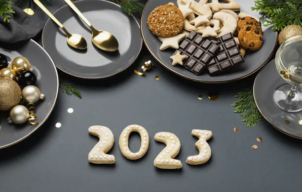 Balls, branches, table, wine, glass, chocolate, cookies, figures