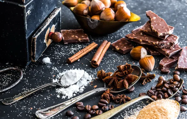 Coffee, chocolate, sugar, nuts, cinnamon, powdered sugar, spices, anise star