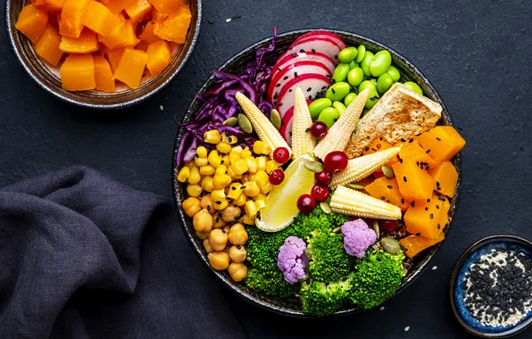 The dark background, table, lemon, food, towel, corn, plate, bowl