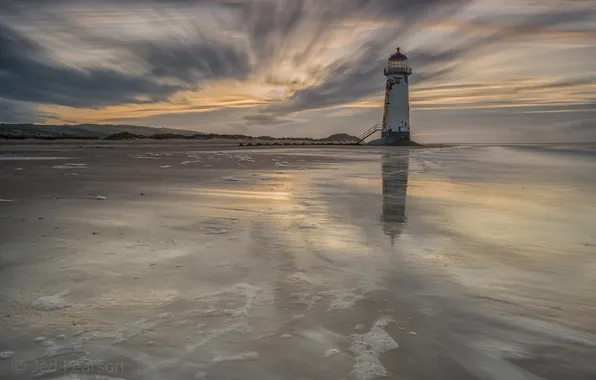 Sea, lighthouse, the evening