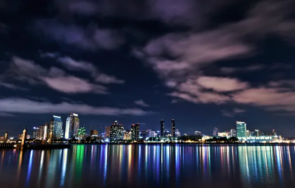 The sky, clouds, night, lights, lights, reflection, the ocean, building