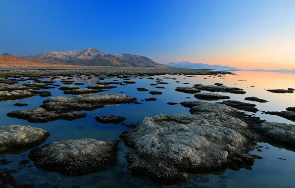 The sky, sunset, mountains, lake, stones