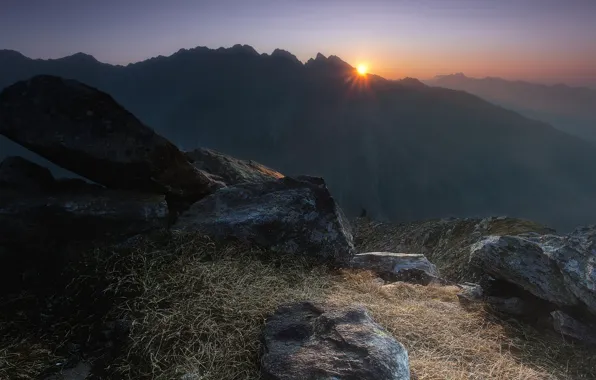 Picture the sun, mountains, stones