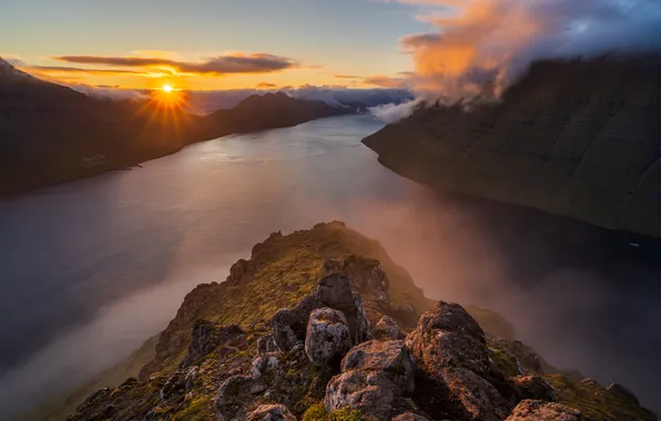 Sea, the sun, clouds, rays, sunset, mountains, fog, stones