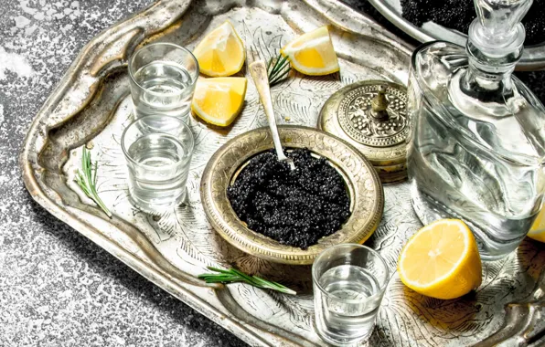 Lemon, vodka, decanter, black caviar