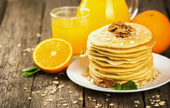 Oranges, juice, nuts, pancakes, cakes, pancake