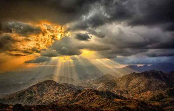 Picture the sun, clouds, mountains, fire, desert