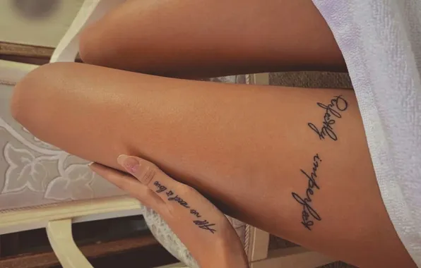 Manicure, tattoo on the hand, slender legs, tattoo on leg, tanned legs