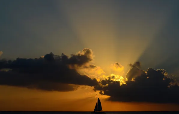 Picture the sky, the sun, clouds, sailboat