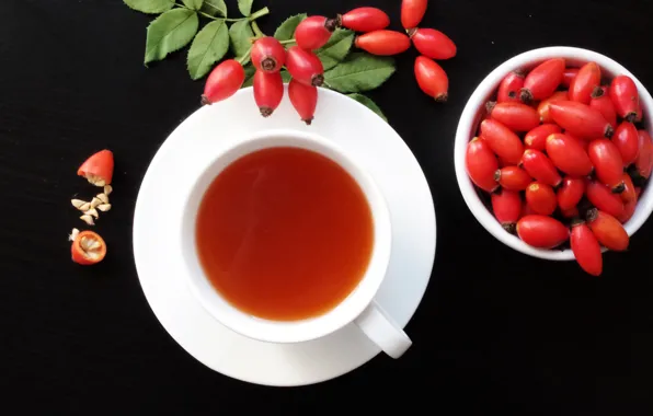 Green leaves, tea, Cup, drink, saucer, rose hips, black Desk, decoction