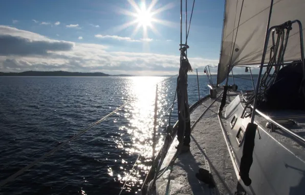 Sea, the sun, reflection, coast, yacht, sail, sailing ship floating in the sea
