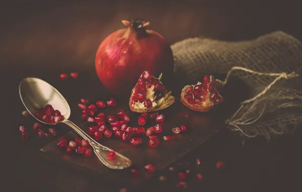 The dark background, garnet, pomegranate grains