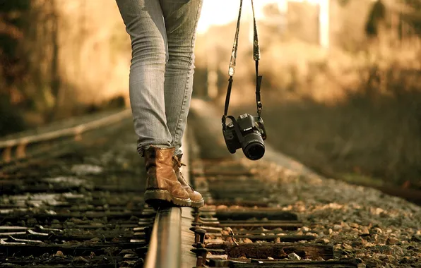 Picture girl, feet, rails, jeans, shoes, the camera