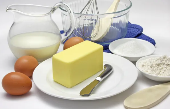 Oil, eggs, milk, knife, plates, pitcher, flour, the spatula