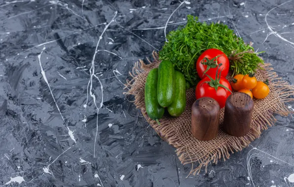 Vegetables, tomatoes, burlap, blue background, parsley, cucumbers, salt shaker, pepper