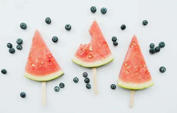 Berries, watermelon, blueberries, placer, light background, slices, slices, on a stick