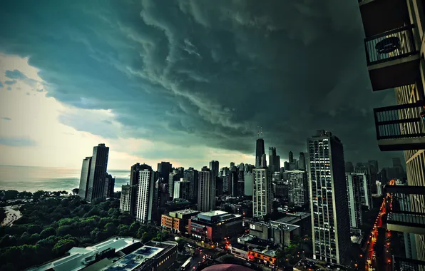 Sea, clouds, skyscrapers