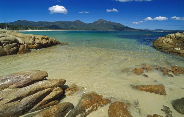 Picture sea, the sky, water, clouds, stones, shore, the hills in the distance