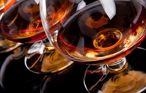 Picture reflection, glasses, black background, cognac