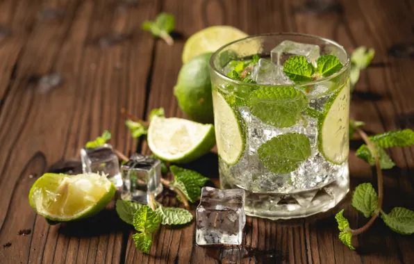 Mojito cocktail with lime and mint in highball glass on a grey stone  background Stock Photo by annapustynnikova