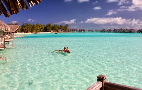 Tropics, resort, exotic, Laguna, canoe in clear blue lagoon, Palma. the ocean