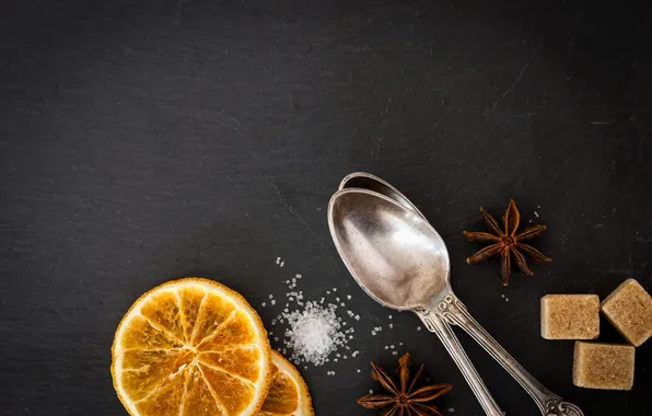 Orange, sugar, star anise, spoon