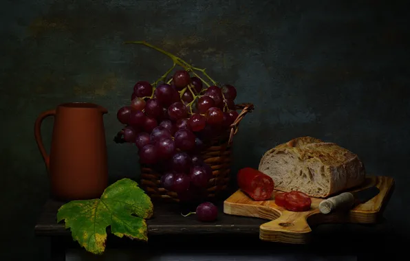 The dark background, table, bread, grapes, pitcher, still life, basket, sausage
