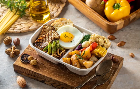 Meat, pepper, scrambled eggs, vegetables, potatoes