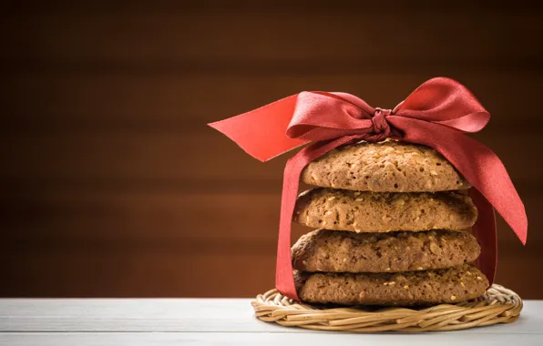 Cookies, wood, cakes, a red ribbon, oat