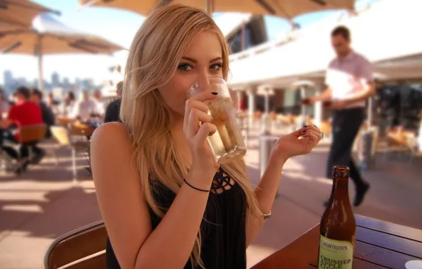 Girl, blonde, drinking, at the table, cider