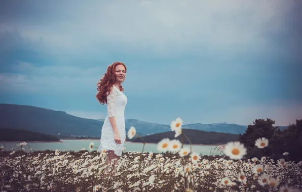 Picture summer, joy, the red-haired girl, chamomile field