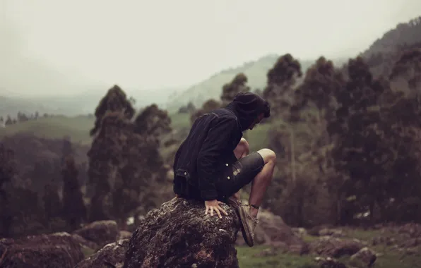 Picture fog, hills, stone, valley, male, sitting, rainy