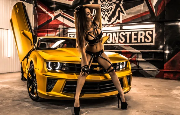 Erotic, beautiful girl, Chevrolet Camaro, yellow car, posing on the car