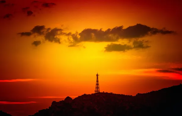 The sky, clouds, mountains, tower, glow