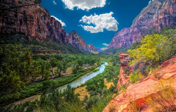 The sky, the sun, clouds, trees, mountains, river, stones, rocks
