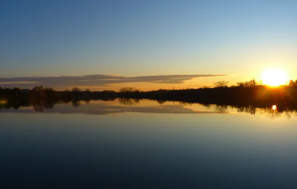 The sun, clouds, trees, reflection, river