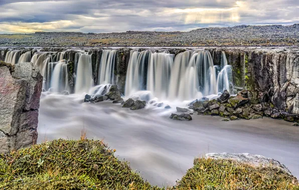 Picture the sky, clouds, river, rocks, waterfall