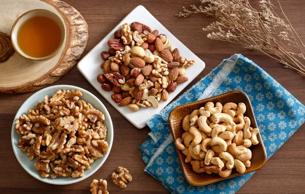 Tea, nuts, almonds, hazelnuts, the dried flowers, walnut, pecan, cashews