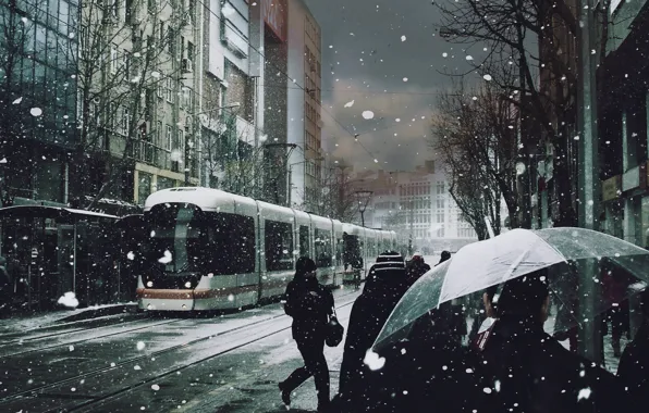 Snow, people, umbrellas, tram