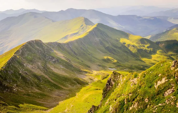 Picture the sky, clouds, mountains, top, haze, ridge