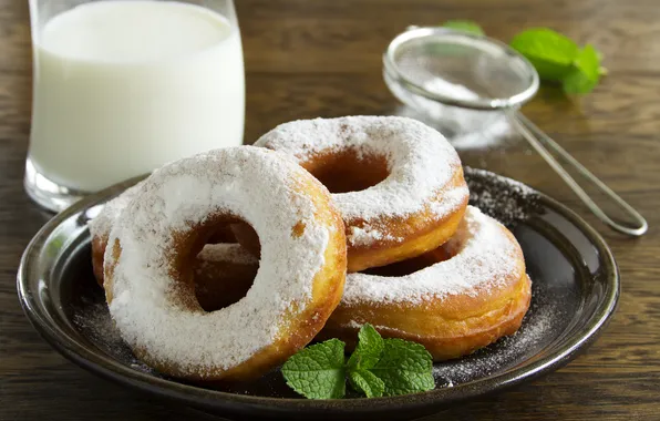 The sweetness, cakes, powdered sugar, doughnuts with vanilla cream