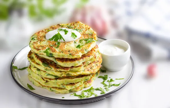 Greens, sour cream, pancakes, squash