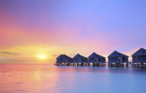 Picture ocean, water villas resort, sunset on Maldives island